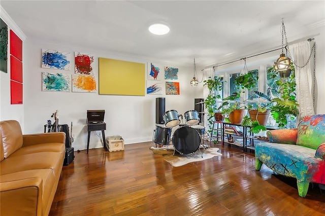 interior space featuring hardwood / wood-style floors and ornamental molding