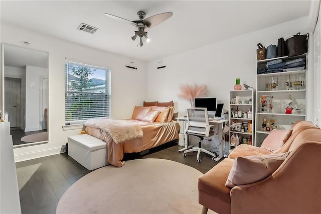 bedroom featuring dark hardwood / wood-style flooring and ceiling fan