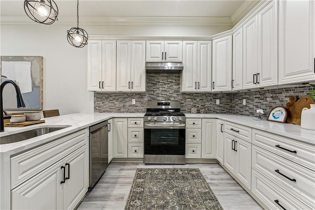 kitchen featuring stainless steel stove, backsplash, black dishwasher, white cabinets, and decorative light fixtures