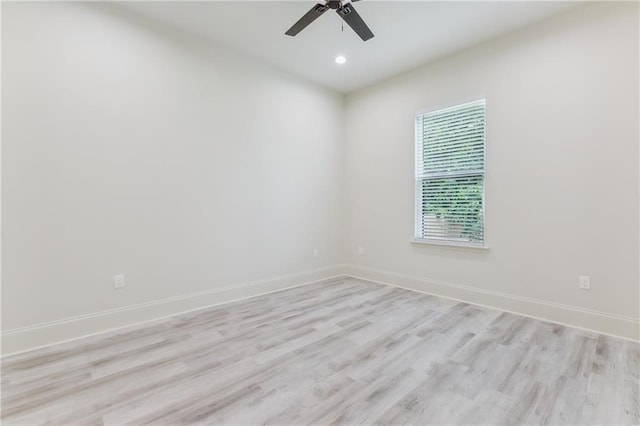 empty room featuring ceiling fan and light wood-type flooring