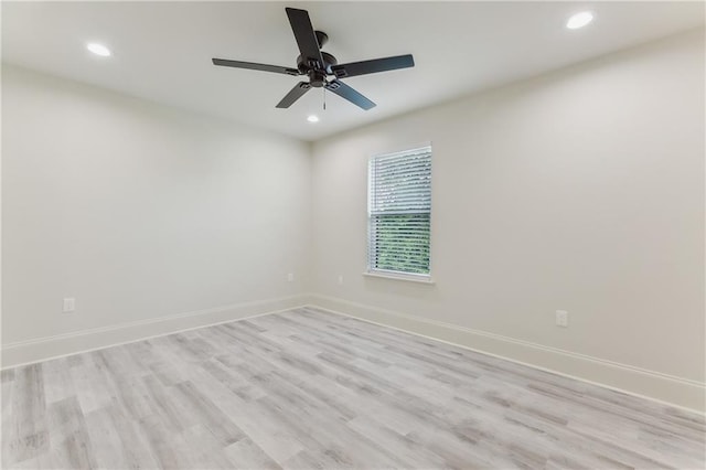 empty room with light hardwood / wood-style floors and ceiling fan