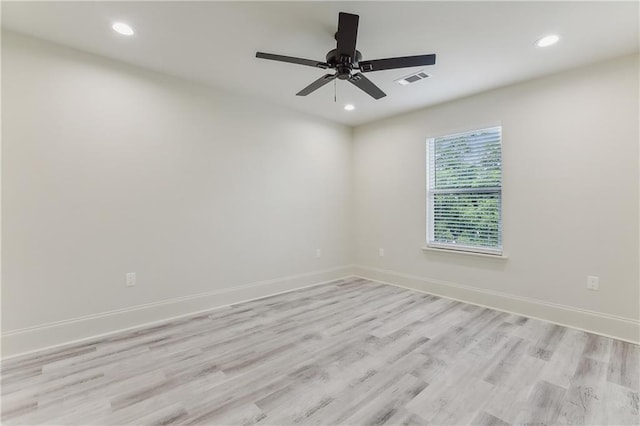 unfurnished room featuring light hardwood / wood-style floors and ceiling fan