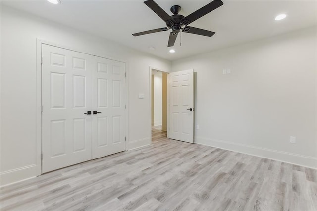 unfurnished bedroom with a closet, ceiling fan, and light wood-type flooring