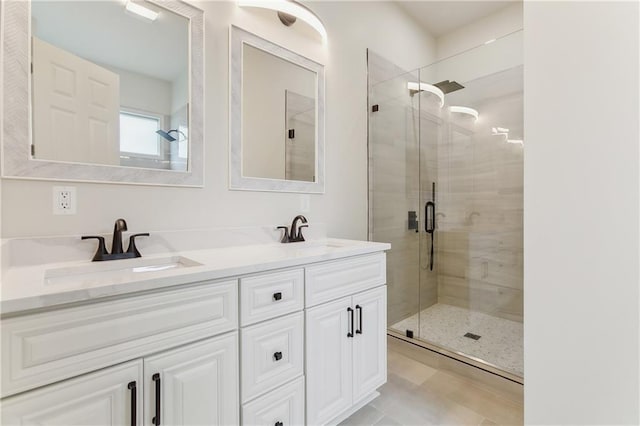 bathroom featuring vanity, tile patterned floors, and walk in shower