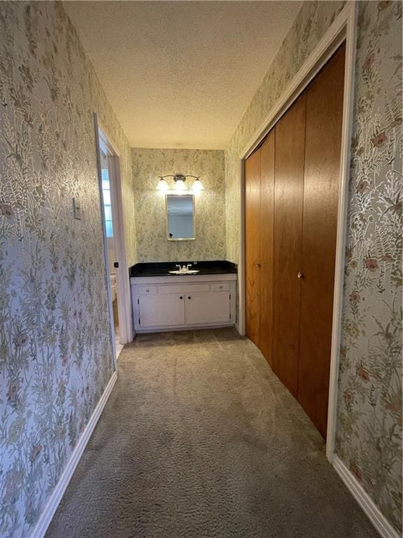 bathroom featuring vanity and a textured ceiling