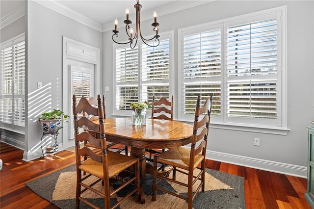 dining room with dark hardwood / wood-style flooring, an inviting chandelier, and a healthy amount of sunlight