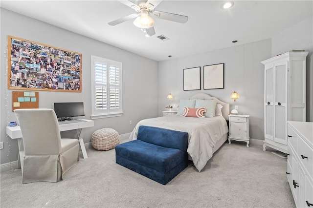 bedroom featuring ceiling fan and light carpet