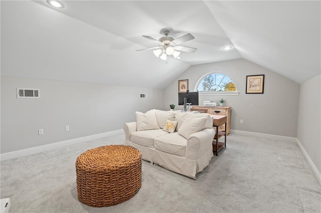 living room with ceiling fan, light carpet, and vaulted ceiling