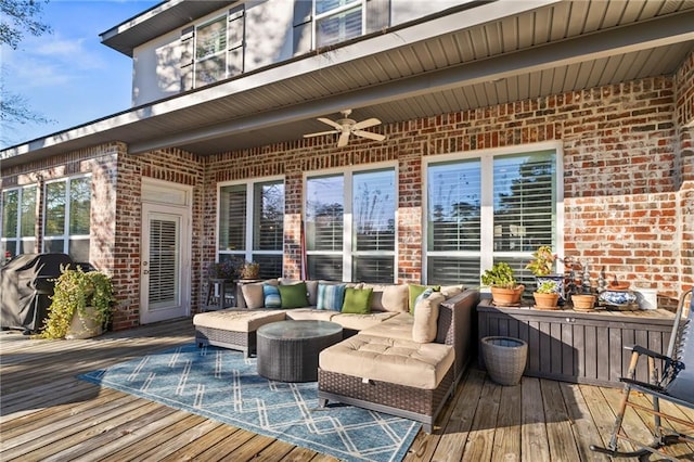 deck featuring an outdoor living space, area for grilling, and ceiling fan