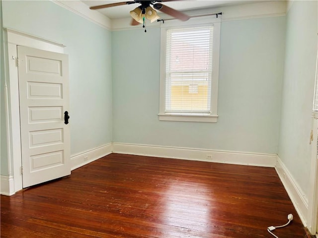 unfurnished room featuring ceiling fan and dark wood-type flooring