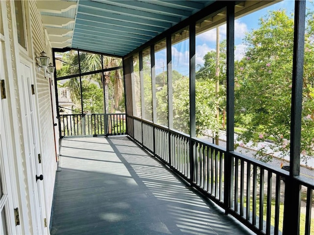 unfurnished sunroom with a wealth of natural light