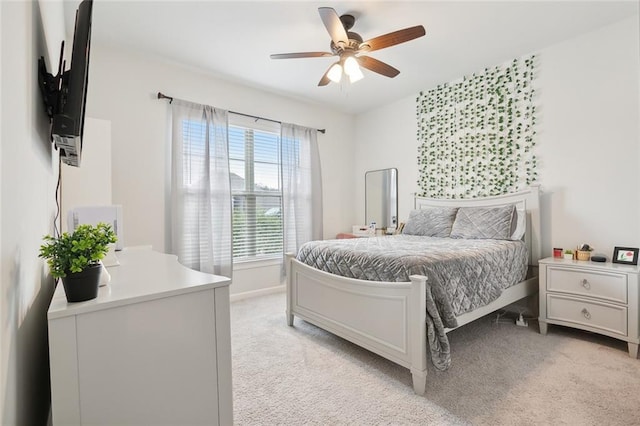 bedroom featuring ceiling fan and light colored carpet