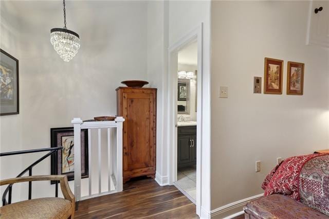 living area featuring dark wood-type flooring and a notable chandelier