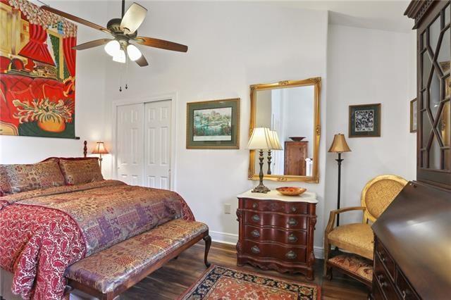 bedroom featuring ceiling fan, a closet, and dark hardwood / wood-style floors