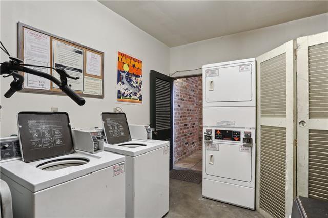 washroom featuring washing machine and dryer and stacked washer / drying machine