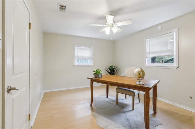 office area featuring plenty of natural light, ceiling fan, and light hardwood / wood-style flooring