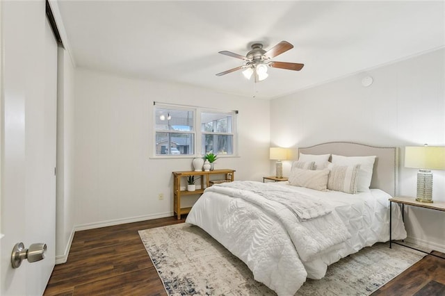 bedroom featuring dark hardwood / wood-style flooring and ceiling fan