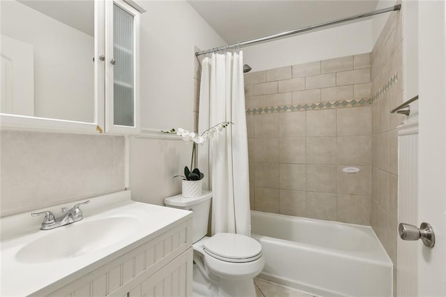 full bathroom featuring vanity, toilet, tile patterned flooring, and shower / tub combo