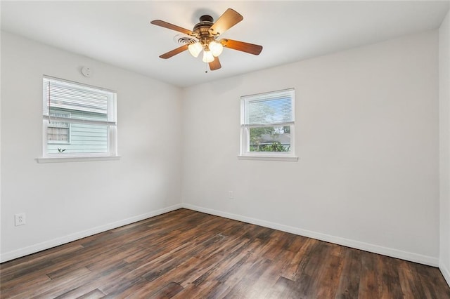 unfurnished room featuring ceiling fan and dark hardwood / wood-style flooring