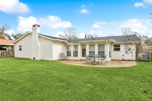 rear view of property with central AC, a yard, and a patio