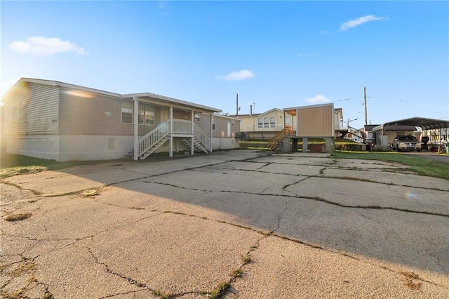 view of front of house featuring a carport