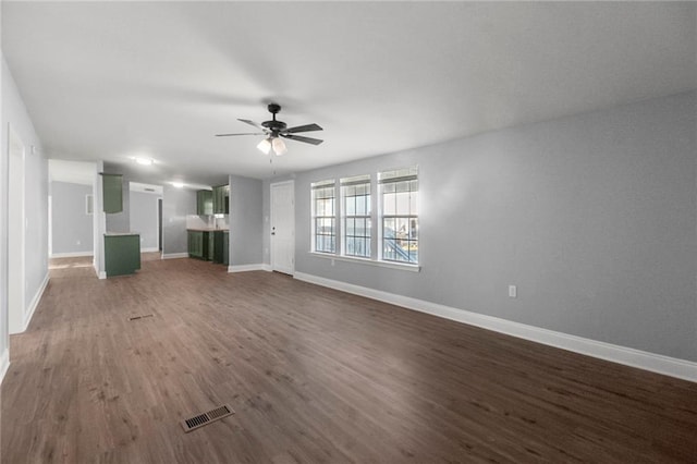 unfurnished living room featuring ceiling fan and wood-type flooring