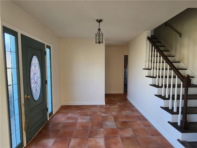 foyer with tile patterned floors