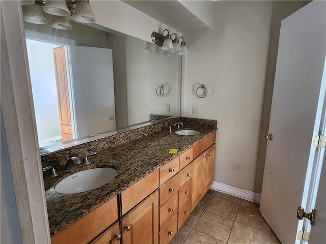 bathroom featuring tile patterned flooring, vanity, and toilet