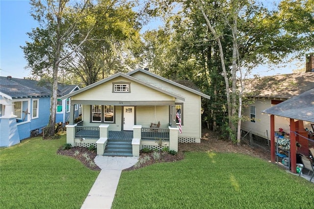 bungalow-style house with a porch and a front lawn