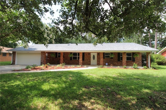 ranch-style home with a front yard, a garage, and covered porch