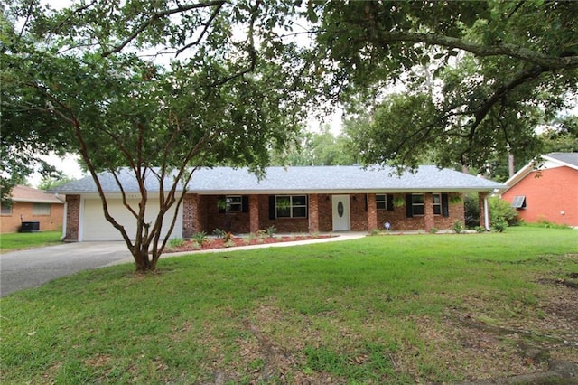 ranch-style house with a garage and a front lawn