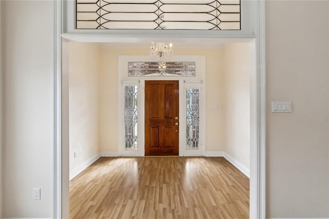 entryway featuring an inviting chandelier and light wood-type flooring