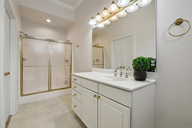 bathroom featuring vanity and a shower with shower door