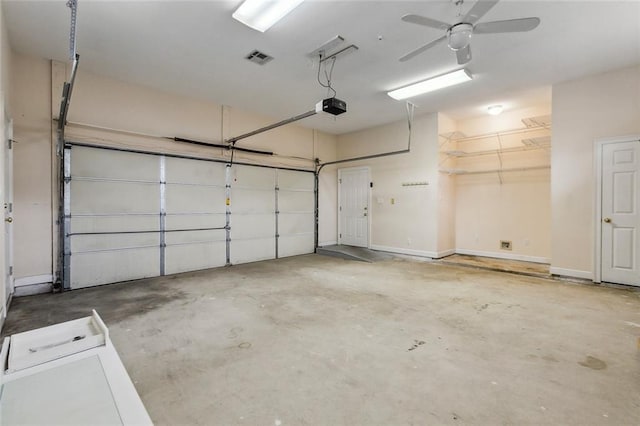 garage featuring ceiling fan and a garage door opener