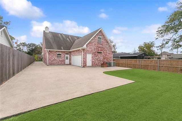 exterior space featuring a lawn, a patio, and central AC