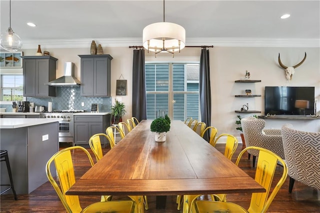 dining room with crown molding and dark wood-type flooring