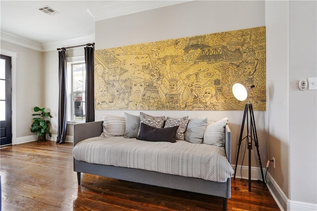 bedroom featuring ornamental molding and dark wood-type flooring