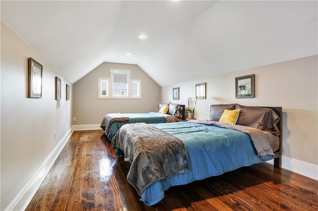 bedroom with dark hardwood / wood-style flooring and vaulted ceiling