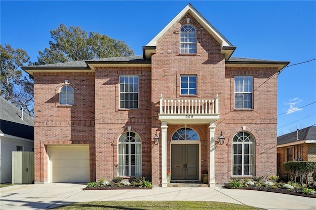 front facade with a balcony and a garage