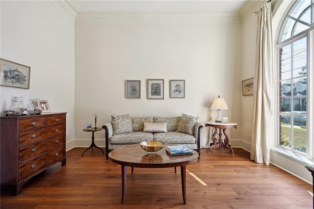 sitting room featuring light hardwood / wood-style flooring and ornamental molding