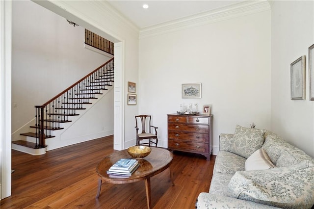 living room with dark hardwood / wood-style floors and ornamental molding