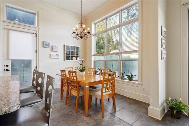 tiled dining area featuring crown molding and an inviting chandelier