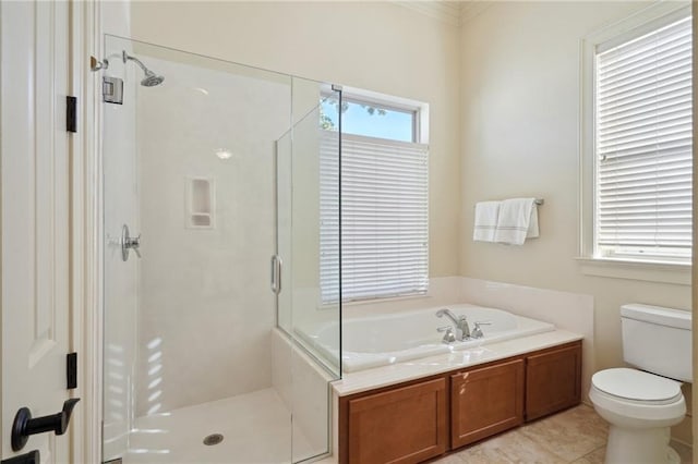 bathroom with tile patterned floors, toilet, and independent shower and bath