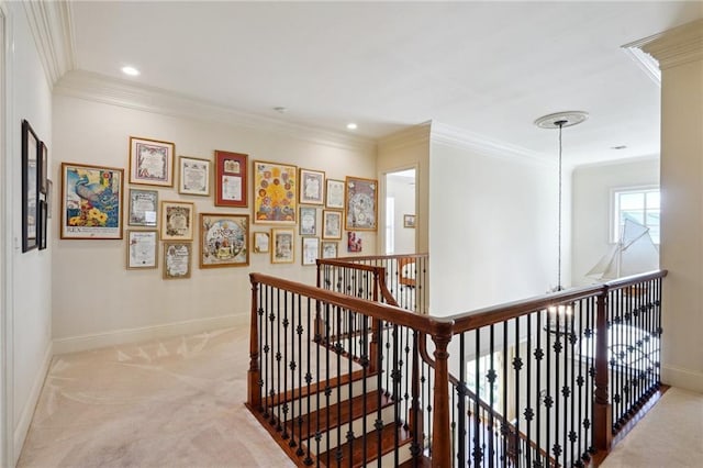 corridor featuring ornamental molding and light carpet