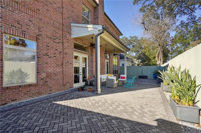 view of patio / terrace featuring outdoor lounge area, ceiling fan, and french doors