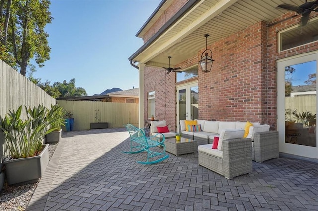 view of patio / terrace featuring an outdoor living space and ceiling fan