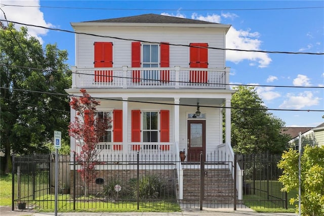 view of front of house with a balcony and covered porch