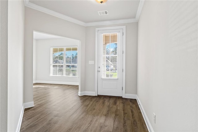 entryway with a healthy amount of sunlight, dark hardwood / wood-style flooring, and crown molding