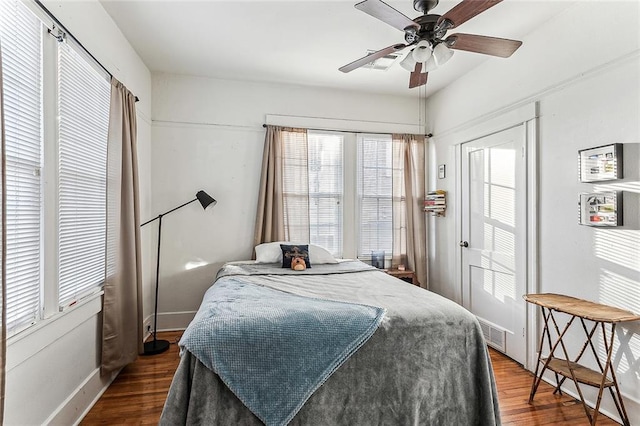 bedroom featuring ceiling fan and dark hardwood / wood-style flooring