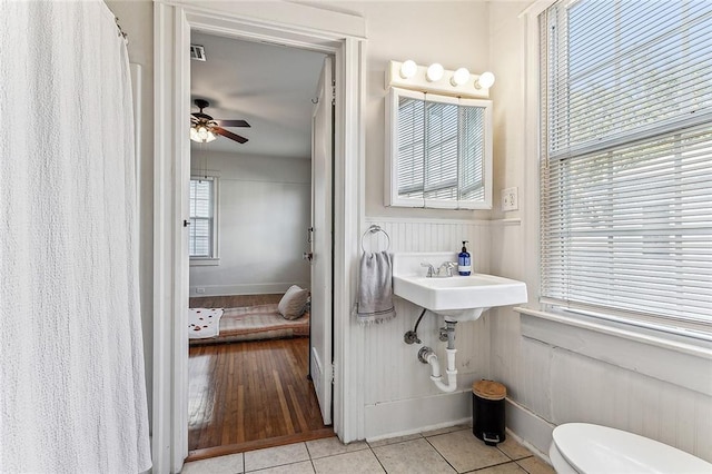 bathroom featuring tile patterned floors, ceiling fan, and toilet